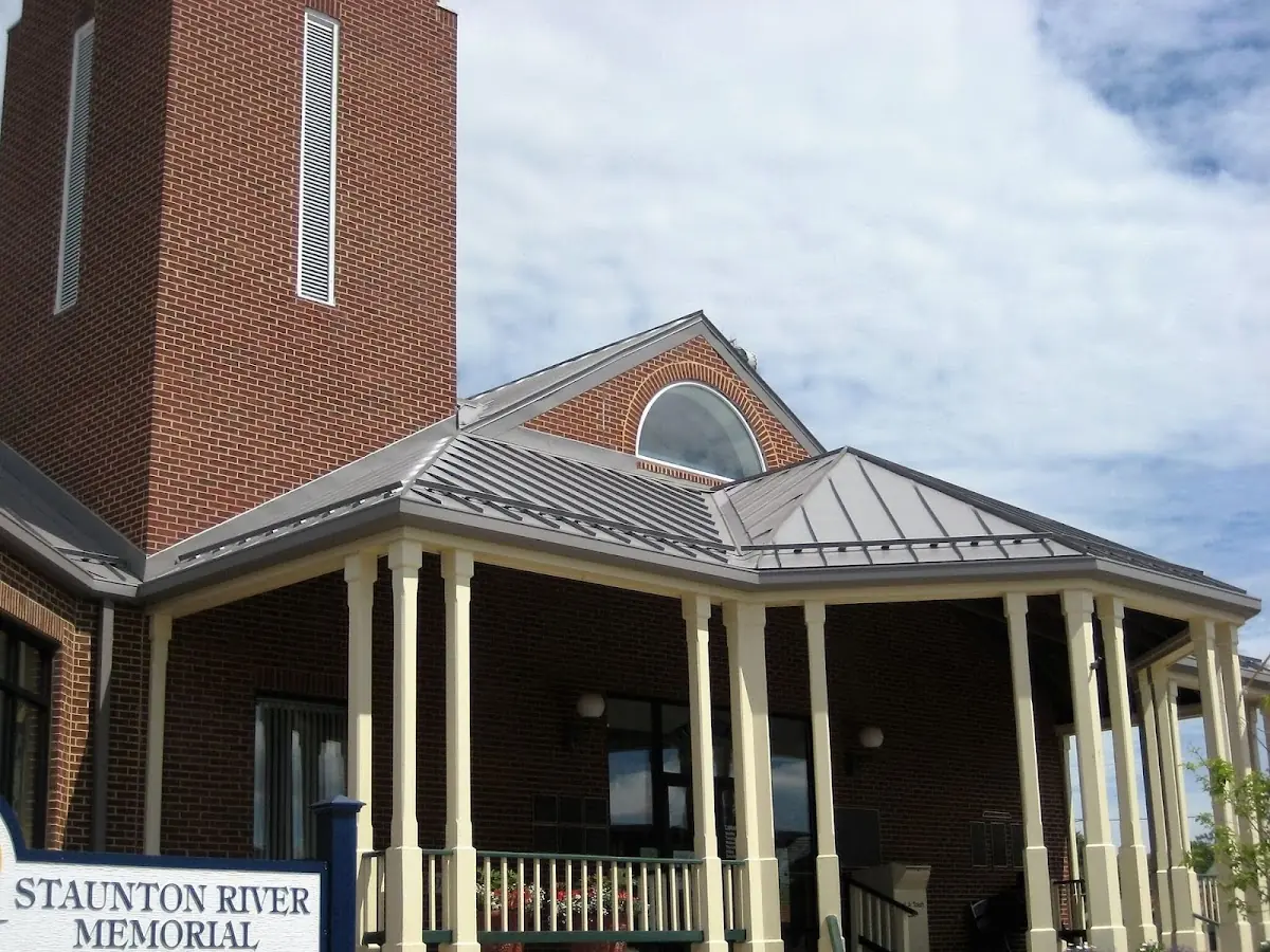Skilled roofing craftsmen working on a residential roof in Collegedale